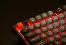 Keychron K8 Pro with Aluminium frame RGB backlight and Gateron Pro Red switches. a close up of a red and black keyboard
