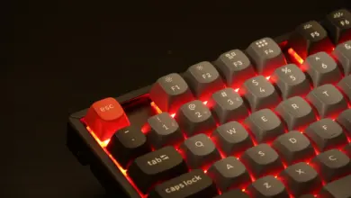 Keychron K8 Pro with Aluminium frame RGB backlight and Gateron Pro Red switches. a close up of a red and black keyboard