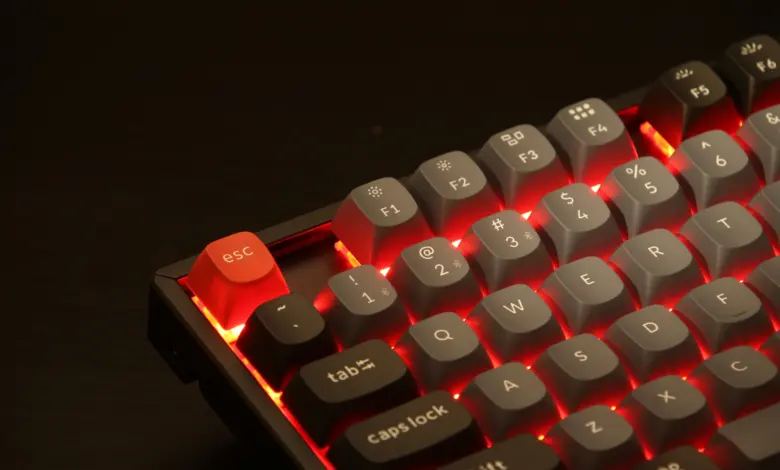 Keychron K8 Pro with Aluminium frame RGB backlight and Gateron Pro Red switches. a close up of a red and black keyboard