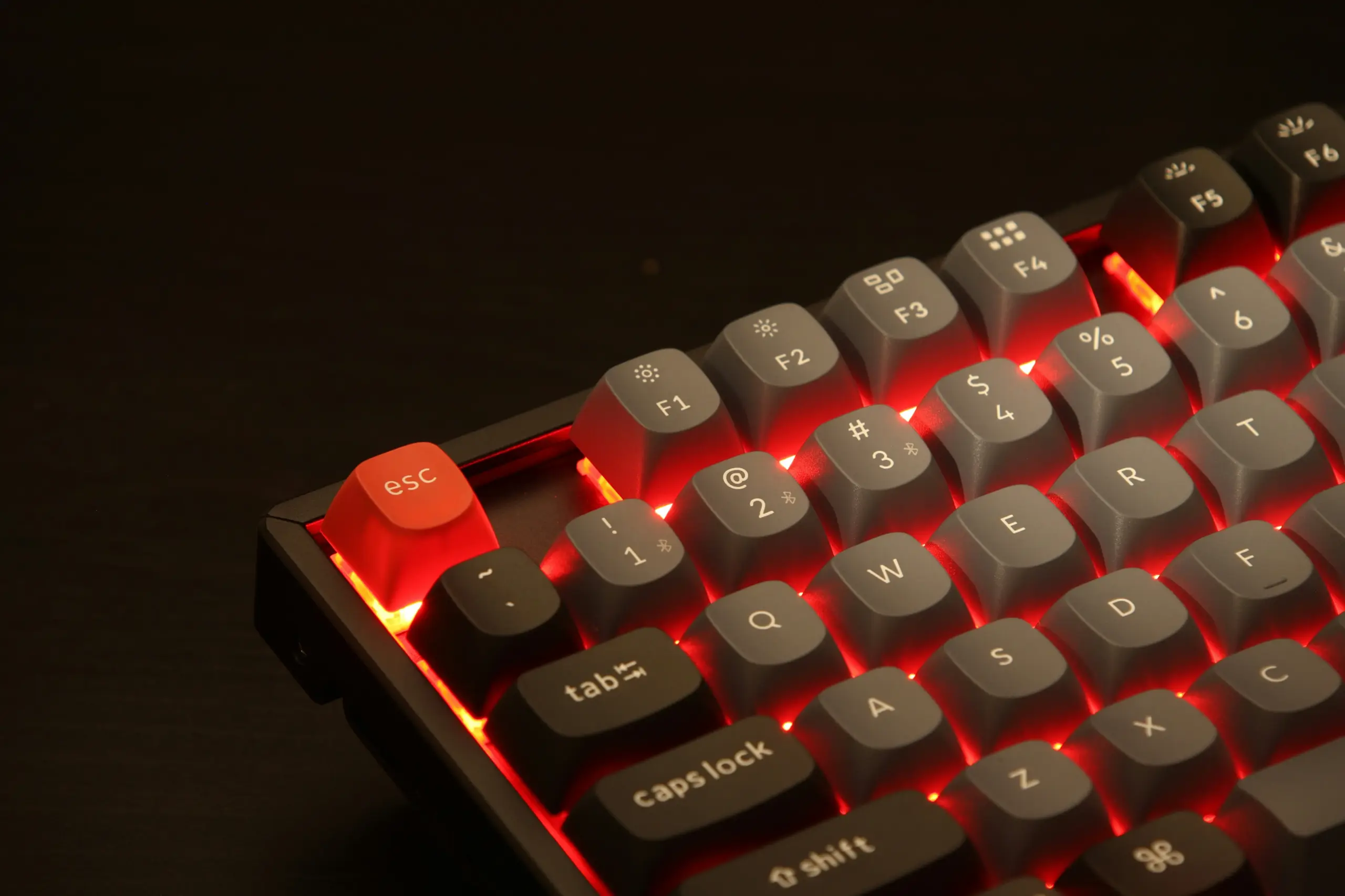 Keychron K8 Pro with Aluminium frame RGB backlight and Gateron Pro Red switches. a close up of a red and black keyboard