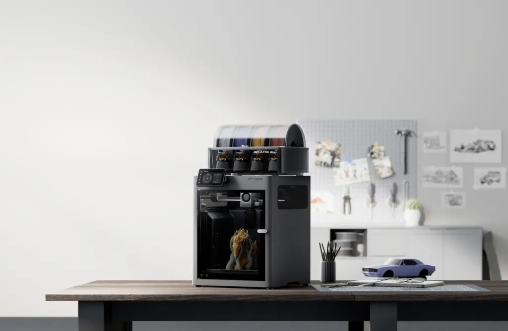 طابعة Bambu Lab X2D مع نظام AMS 2 Pro على مكتب